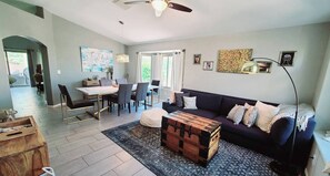 Experience seamless flow in our open floor plan, where the cozy living room transitions effortlessly to the dining room, kitchen, and entertainment area. It's a space designed for effortless connection and comfort for you and yours.