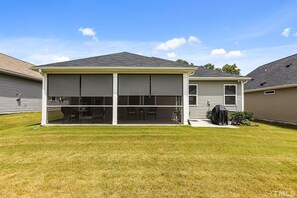 Large screened in porch with sun shades