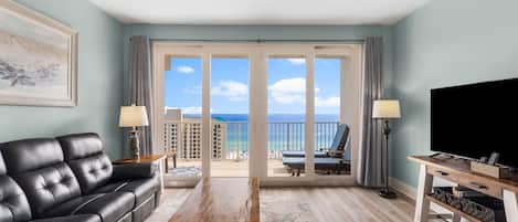 Living Area with Stunning Ocean Views, 55 inch Smart TV, Leather Reclining Sofa, and Oversized Private Balcony Access