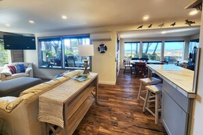 Open concept living/dining/kitchen which is open and airy.