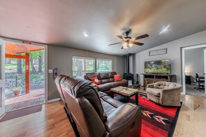 Gather around the wood-burning fireplace & open picture windows for bright, cozy living.