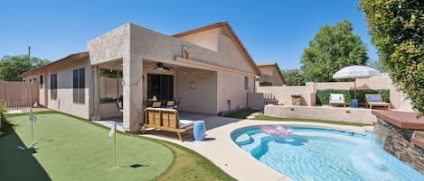 Spa pool, mini putt, lounge chairs, fire pit, and patio