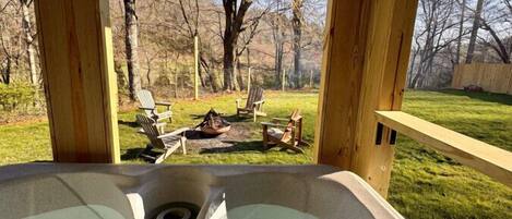Soak in the Hot tub and  warm up next to the firepit in the fenced-in back yard.