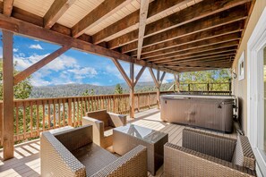 Soak in the hot tub as you take in the vistas.