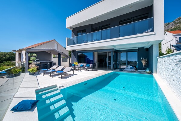 Heated pool with lounge area.