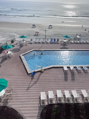 Looking down at the pool and beach from our balcony