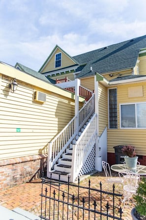 Staircase that you must take to get to this 2nd story apartment. To the right, your private patio.