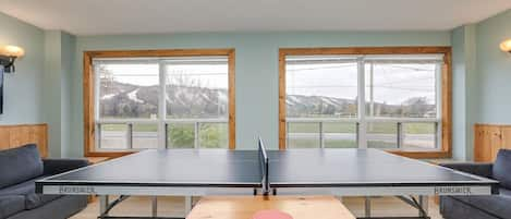 Ping Pong Table located on main floor with 2 pull out couches for your entertainment.  This room faces the road and has a breathtaking view of the mountain.