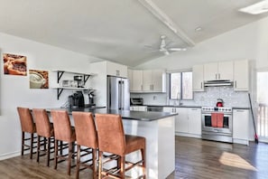 Kitchen with island bar and counter space