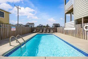 pool view - Take a swim in the private pool with loungers .