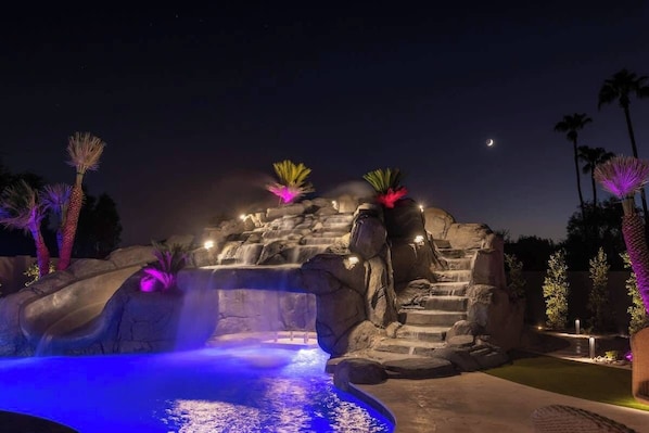 Dive into the sparkling lagoon pool with a cascading waterfall.
