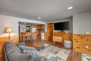 Comfortable main living space includes Smart TV and opens into the dining are and kitchen