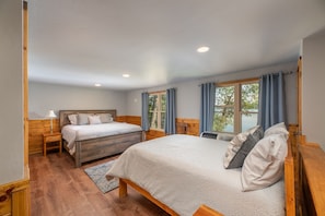 Bedroom 3 includes a King and Full size bed, is open to the stairway to downstairs and includes views of the lake