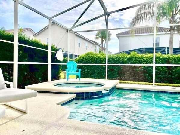 A fully screened large private pool and spa
