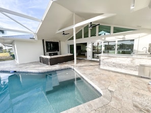 Back Patio and Pool, featuring an outdoor kitchen and fireplace and outdoor TV