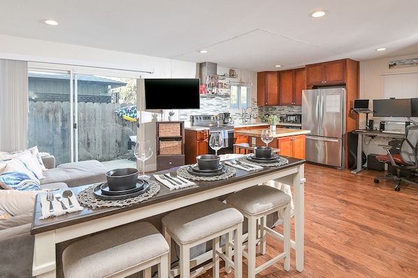 Open Floor Plan - Combined Living Room, Standing Desk Setup, and Kitchen