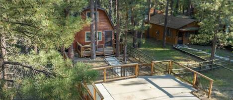 This 2-story cabin sits right in the middle of greeneries.