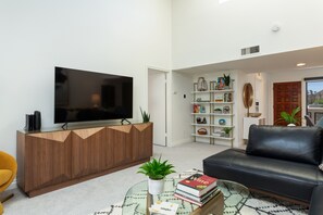 Samsung 65" TV to stream all your favorite shows. Door to primary suite & bath.