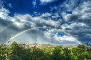 A spectacular rainbow over the cliffs after a rainstorm.