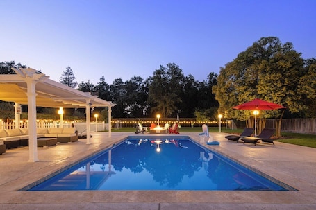 Outdoor pool area, with gas fire place.