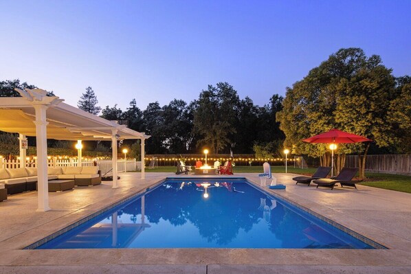 Outdoor pool area, with gas fire place. 