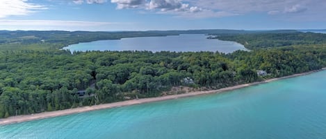 view of beach with North Lake Leelanau in the distance.  beach walk for miles