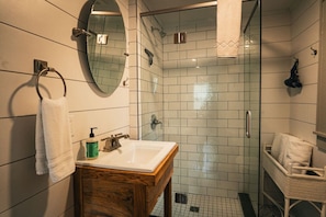 Step into luxury with this beautiful bathroom featuring a sleek glass shower