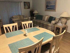 Main living area with dining table and chairs