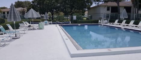 Community heated pool directly adjacent to condo