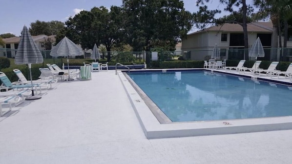 Community heated pool directly adjacent to condo