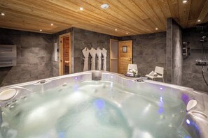 Escape to our shared relaxation space, where an inviting indoor hot tub and sauna await to melt away the day's adventures.