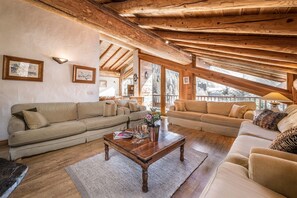 Step into a space where modern aesthetics meet alpine warmth, thanks to our chalet's tasteful and sophisticated interior design.