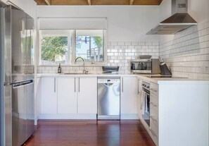 Cook up a feast in the contemporary kitchen, fitted with modern appliances and utensils to make a meal at home.
