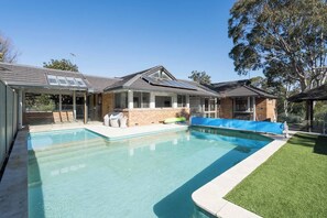 Discover the charm of this elegant home, nestled amidst the lush surroundings of Mount Eliza, where you can unwind in the pool and enjoy ample living spaces.