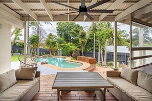 This house is made for outdoor living with alfresco dining areas, swinging chair and BBQ.
