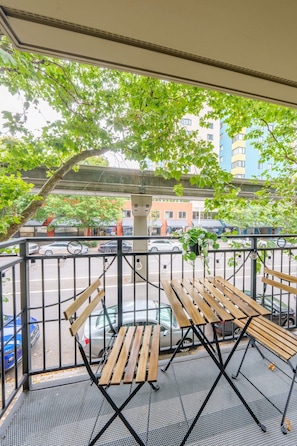 Step outside your private balcony with a view of the monorail gliding past.