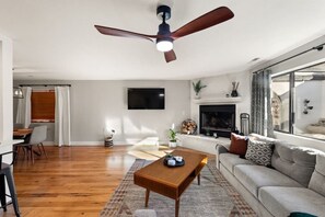 Living room with a flat-screen tv and fireplace