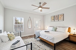 Master Bedroom- en suite bath, towels, toilet paper, shampoo, conditioner, body wash, overhead fan, king bed, extra bed, thoughtfully designed