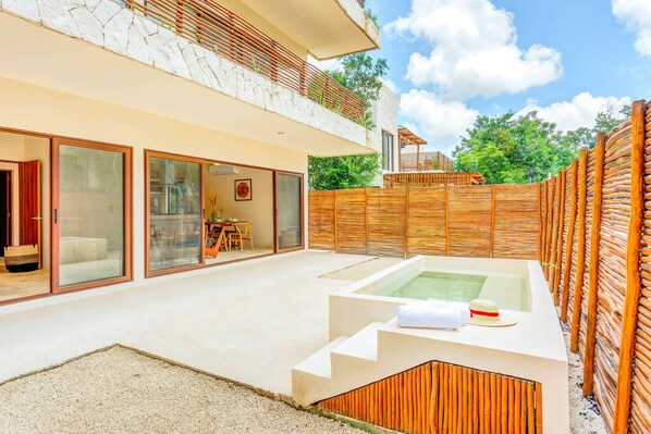 The private backyard patio with a plunge pool is the perfect spot for enjoying a refreshing dip!