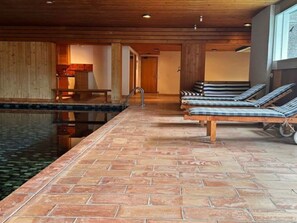 Indoor Pool Lounge with Wooden Finishes