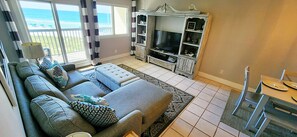 Pullout sofa living room with balcony overlooking the beach