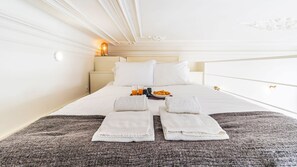 Rest and rejuvenation are on the agenda in this charming bedroom area. From the sumptuous bedding to the lovely ceiling, every element invites you to unwind and have a peaceful night's sleep. #bedroom #airbnb