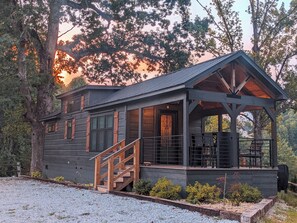 Our charming cabin is framed by the best sunsets and lush rolling hills