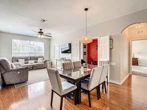 Gather around the spacious dining area, perfect for family meals, game nights, or sharing stories over dinner.