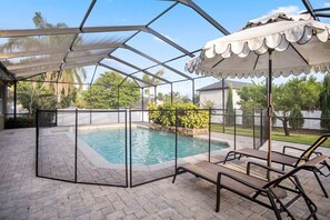 2 lounge chairs under the shade.