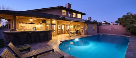 Private backyard with outdoor seating, BBQ grill, pool, hot tub, and fire pit.