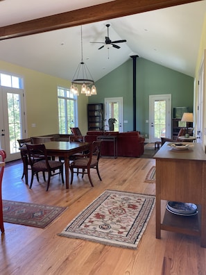 Open living area, 15ft+ ceilings, dining table seats 6