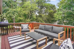 Unwind on the outdoor balcony with comfortable seating and scenic views — ideal for enjoying your morning coffee or evening conversations.