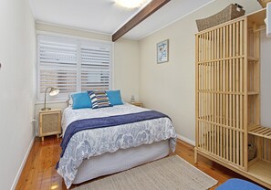 Bedroom with comfy queen bed.