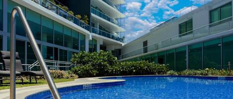 Relaxing outdoor pool with loungers